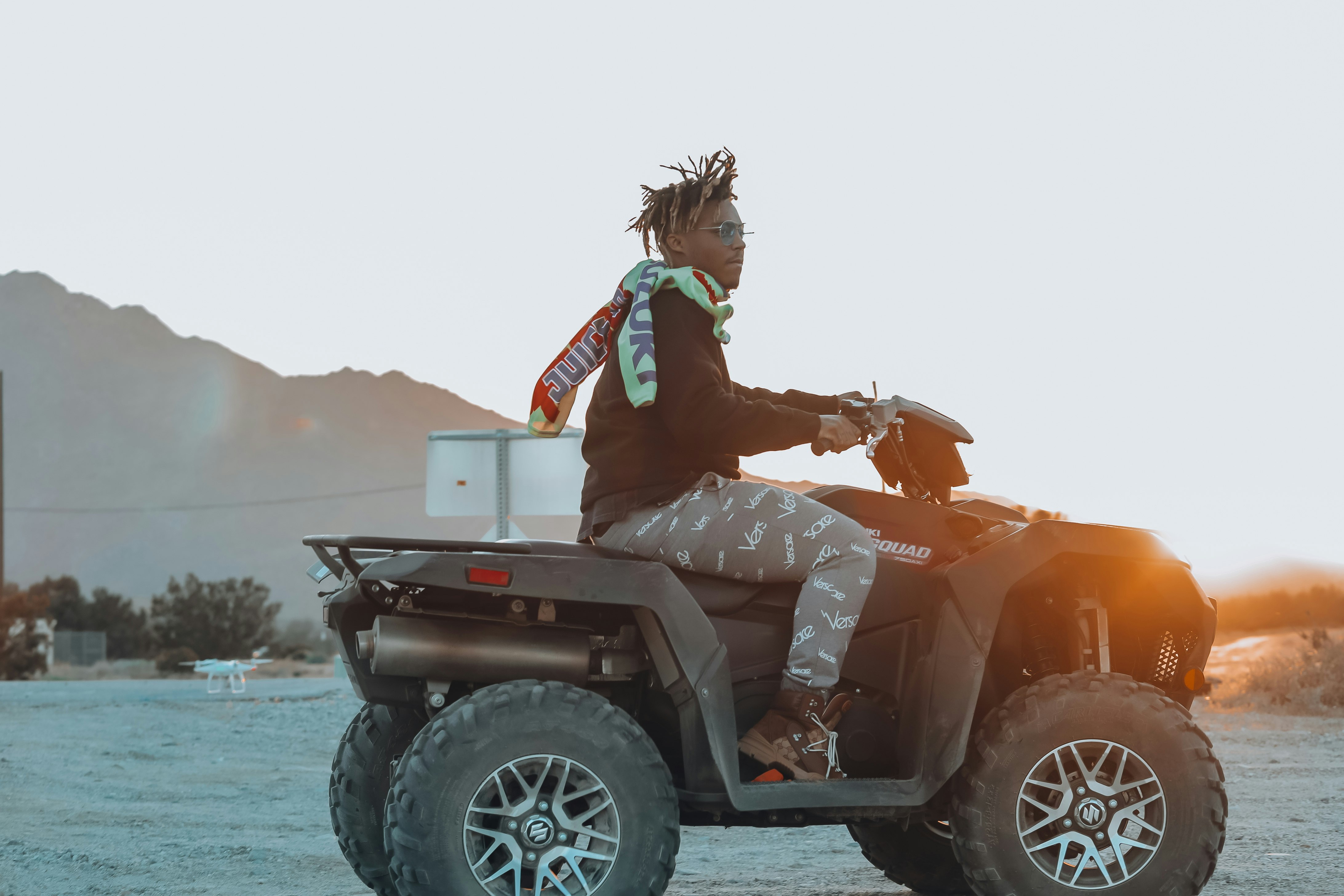 man riding ATV during daytime