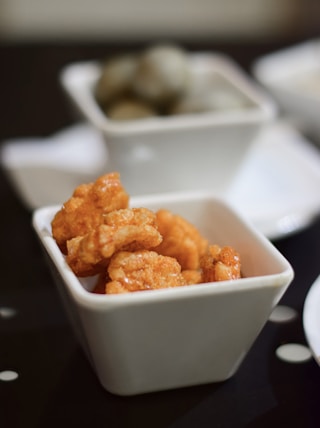 close-up photo of nuggets in white ceramic bowl