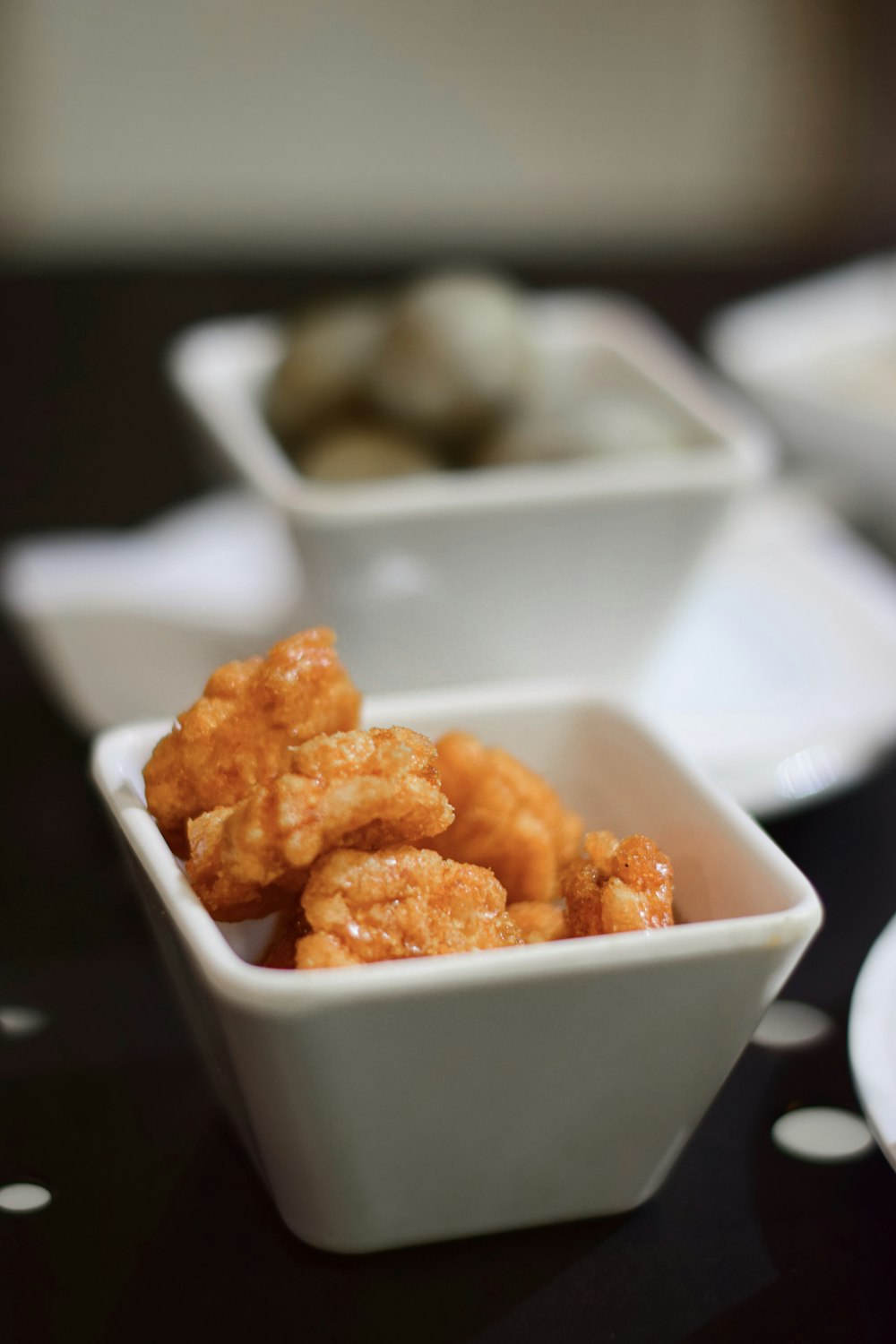 close-up photo of nuggets in white ceramic bowl