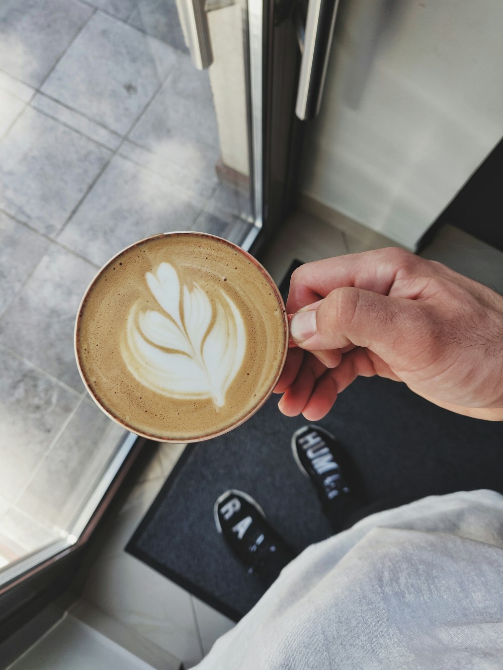 person holding latte