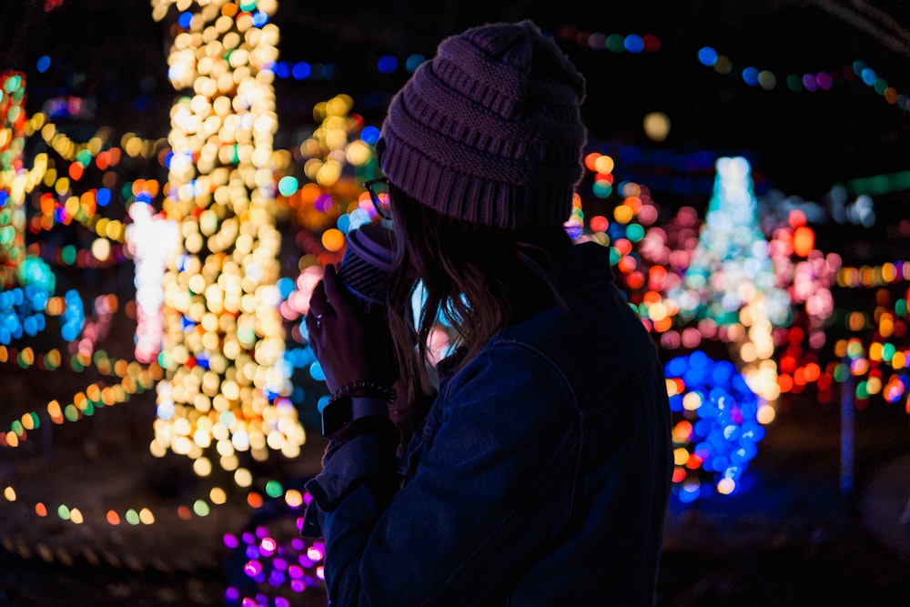 bokeh photography of woman near lights