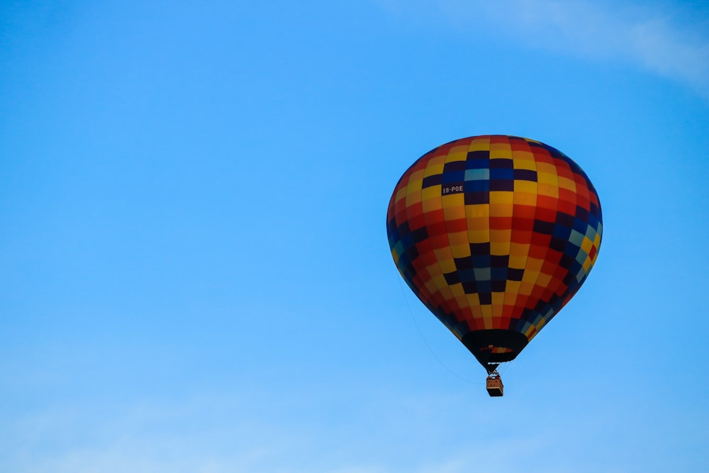 yellow and multicolored hot air balloon