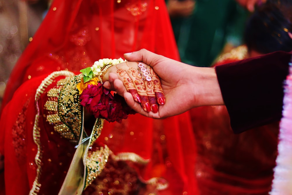 woman in red and gray wedding sari dress