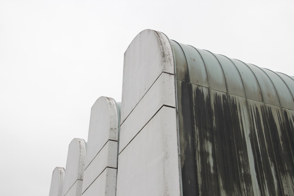 low-angle photography of white concrete building