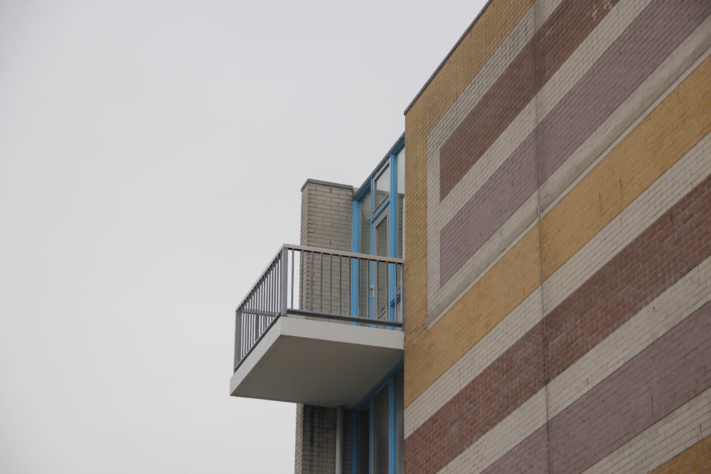 low-angle photography of white balcony