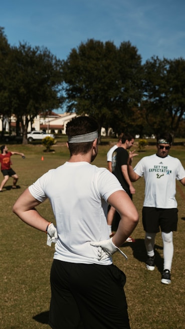 Participants engaged in a community sports activity under sunny skies in Provence