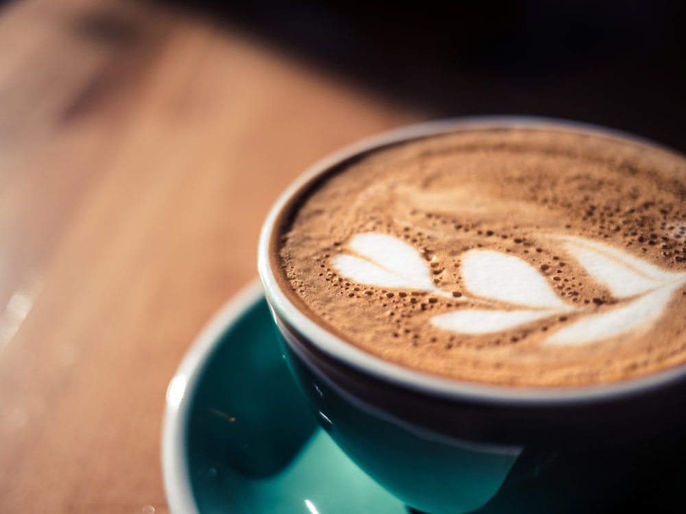 blue an white ceramic coffee cup with cappuccino