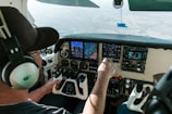 Single-pilot aircraft cockpit with First Officer providing hands-free assistance.