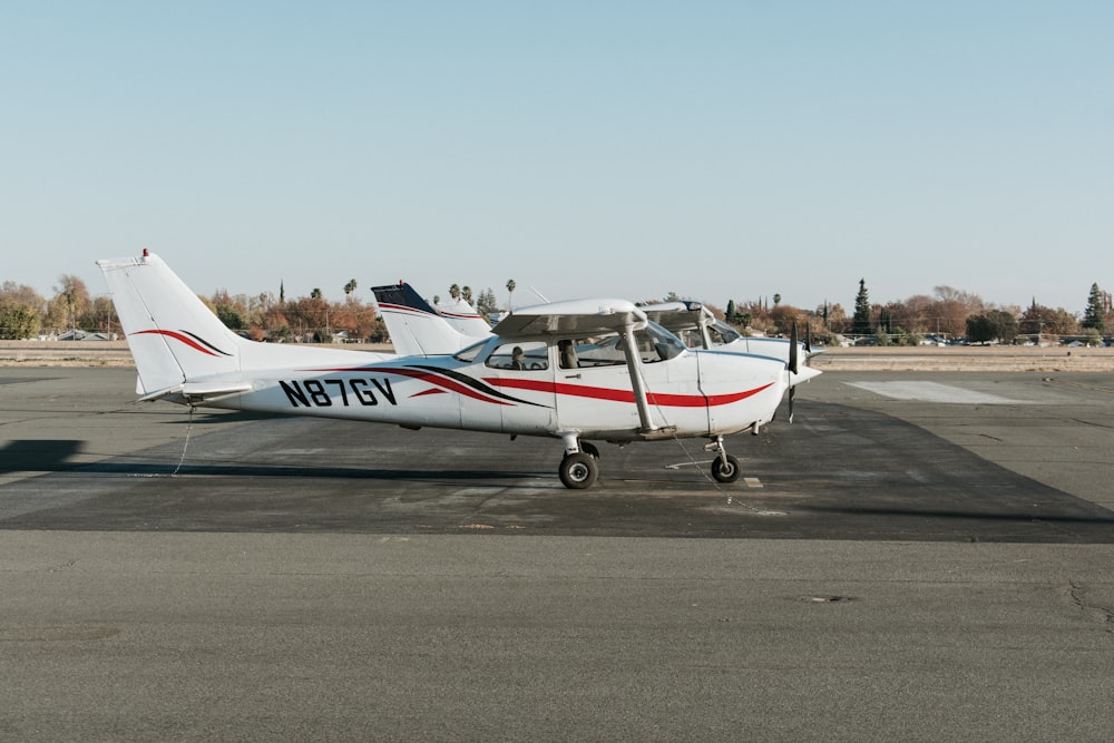 white and red aircraft