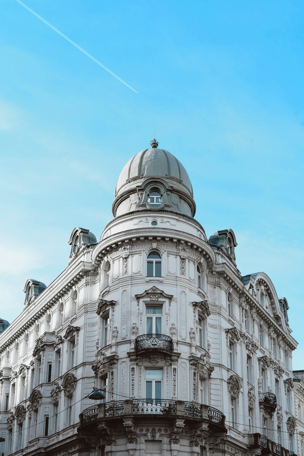 a large white building with a sky background