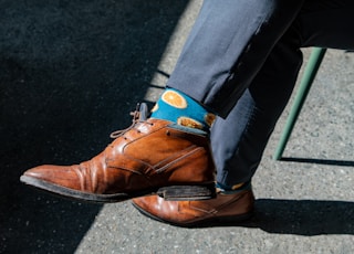 pair of brown leather dress shoes