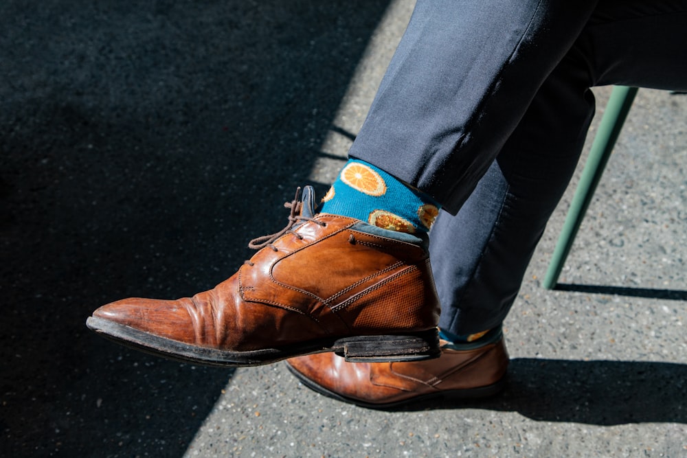 pair of brown leather dress shoes