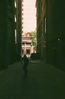 A tall comic-style panel showing a rollerblader weaving through neon-lit alleyways at night.