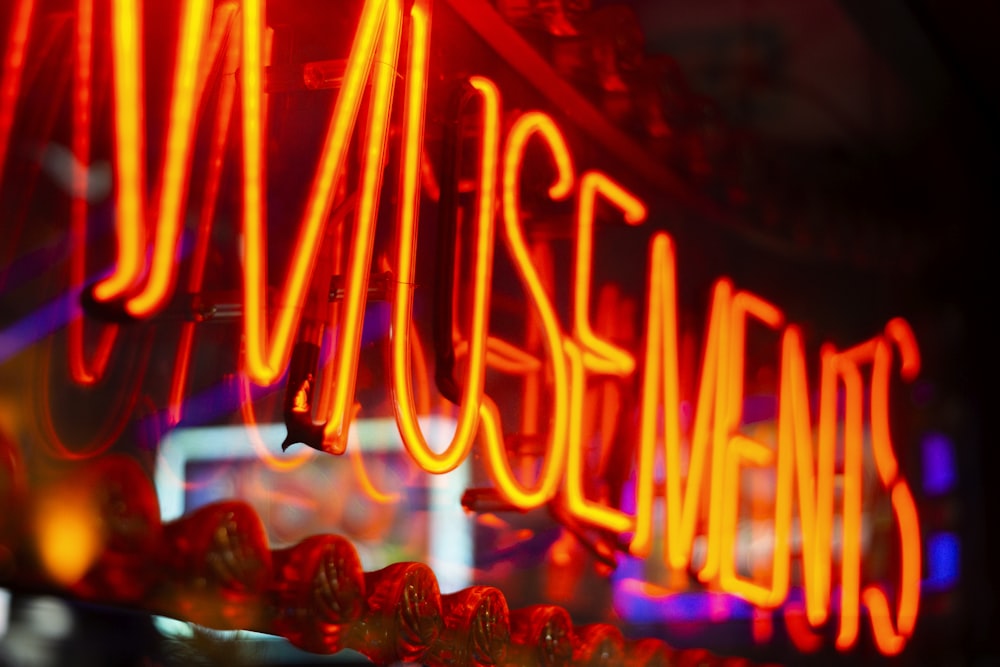 a close up of a neon sign on a building