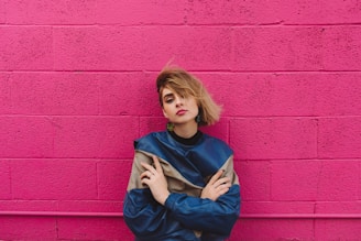 shallow focus photo of woman in blue and gray long-sleeved shirt