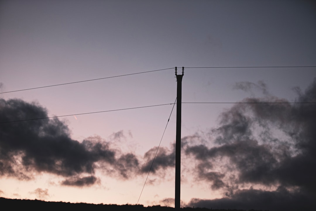 silhouette of electric post