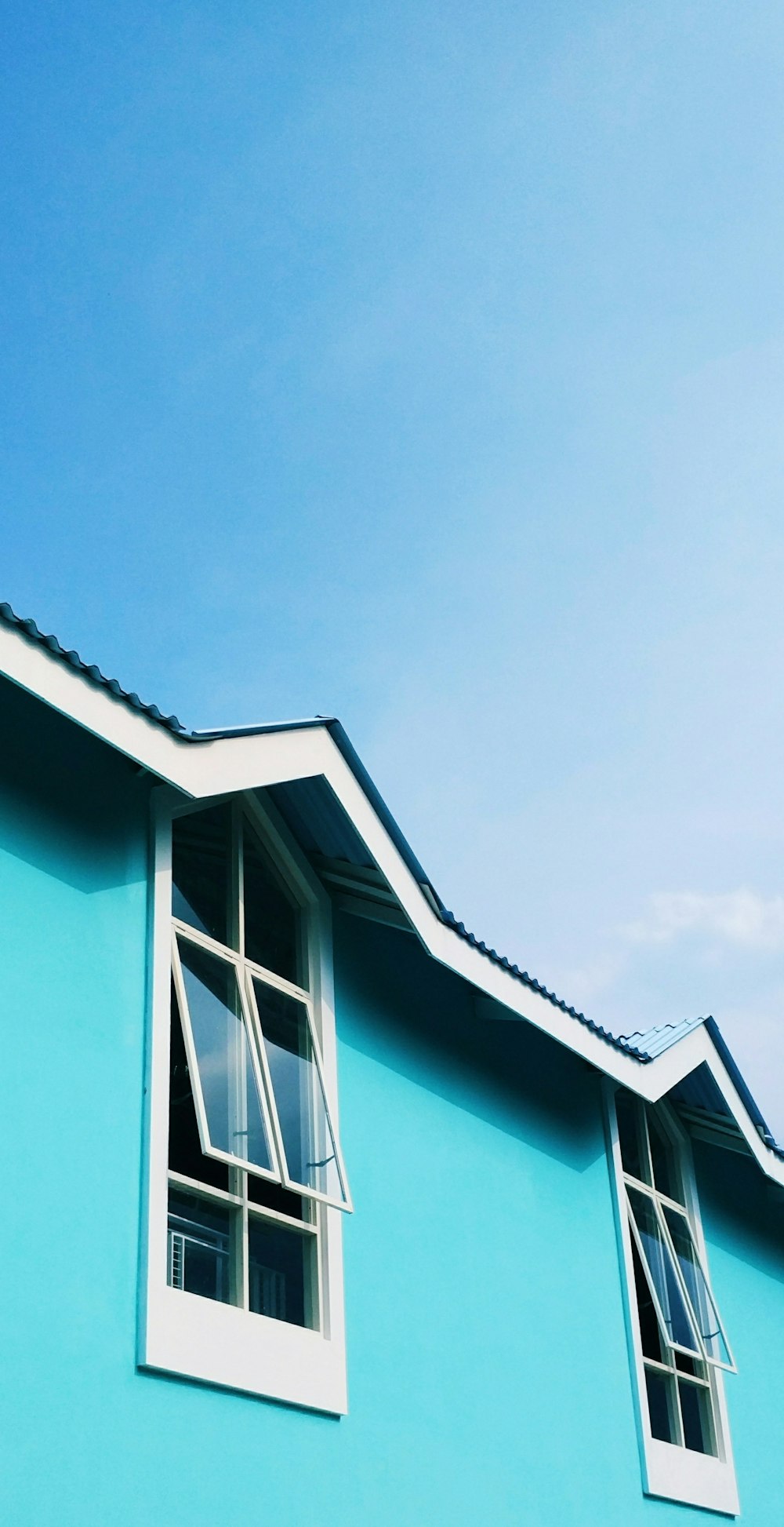 view photography of blue concrete house