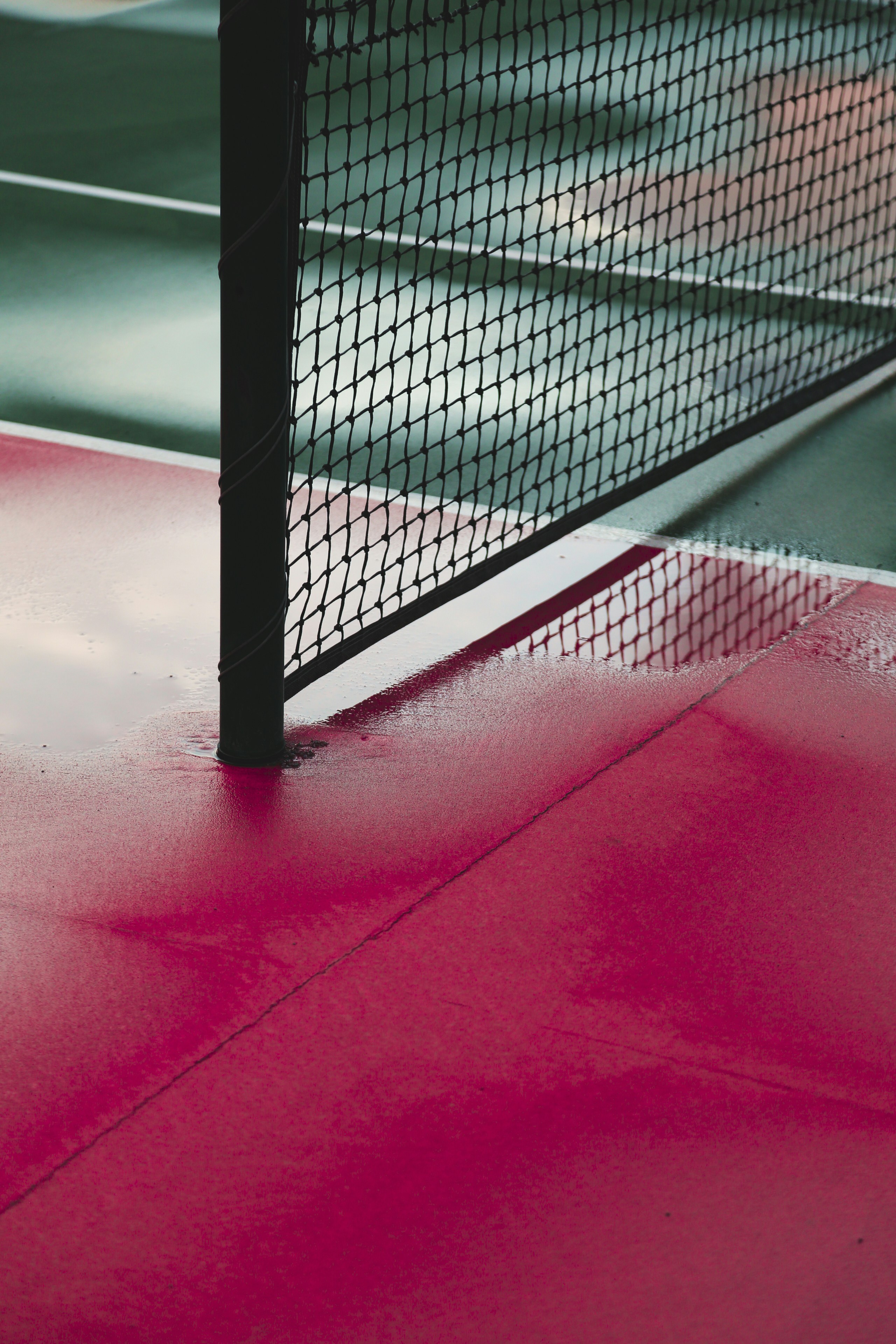 a tennis court with a net on top of it