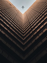 worm view photo of brown building during daytime