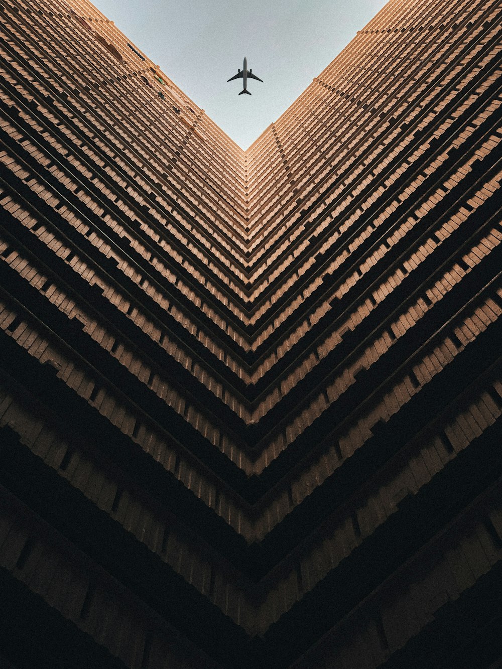 worm view photo of brown building during daytime