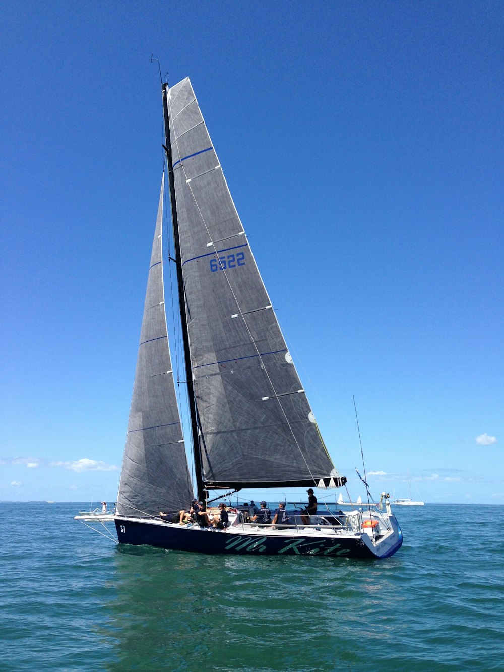 gray and black sailboat during daytime