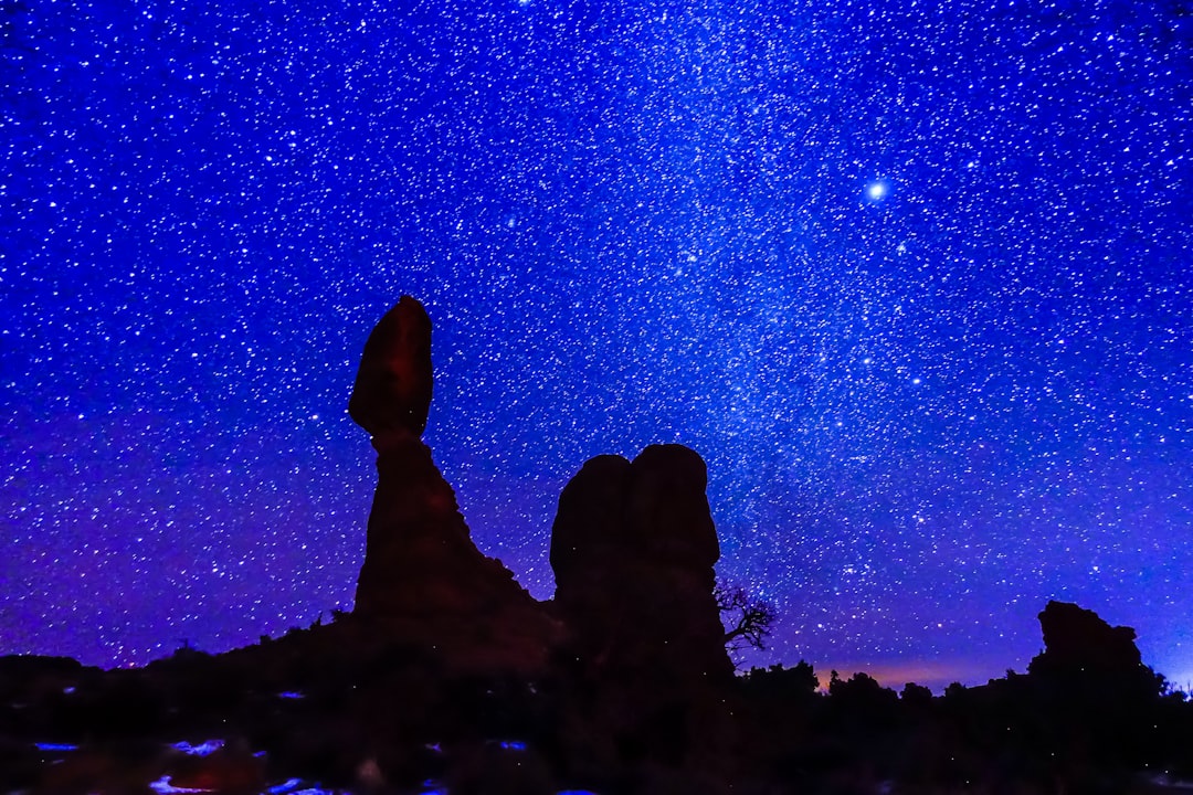 silhouette photography of rock formation