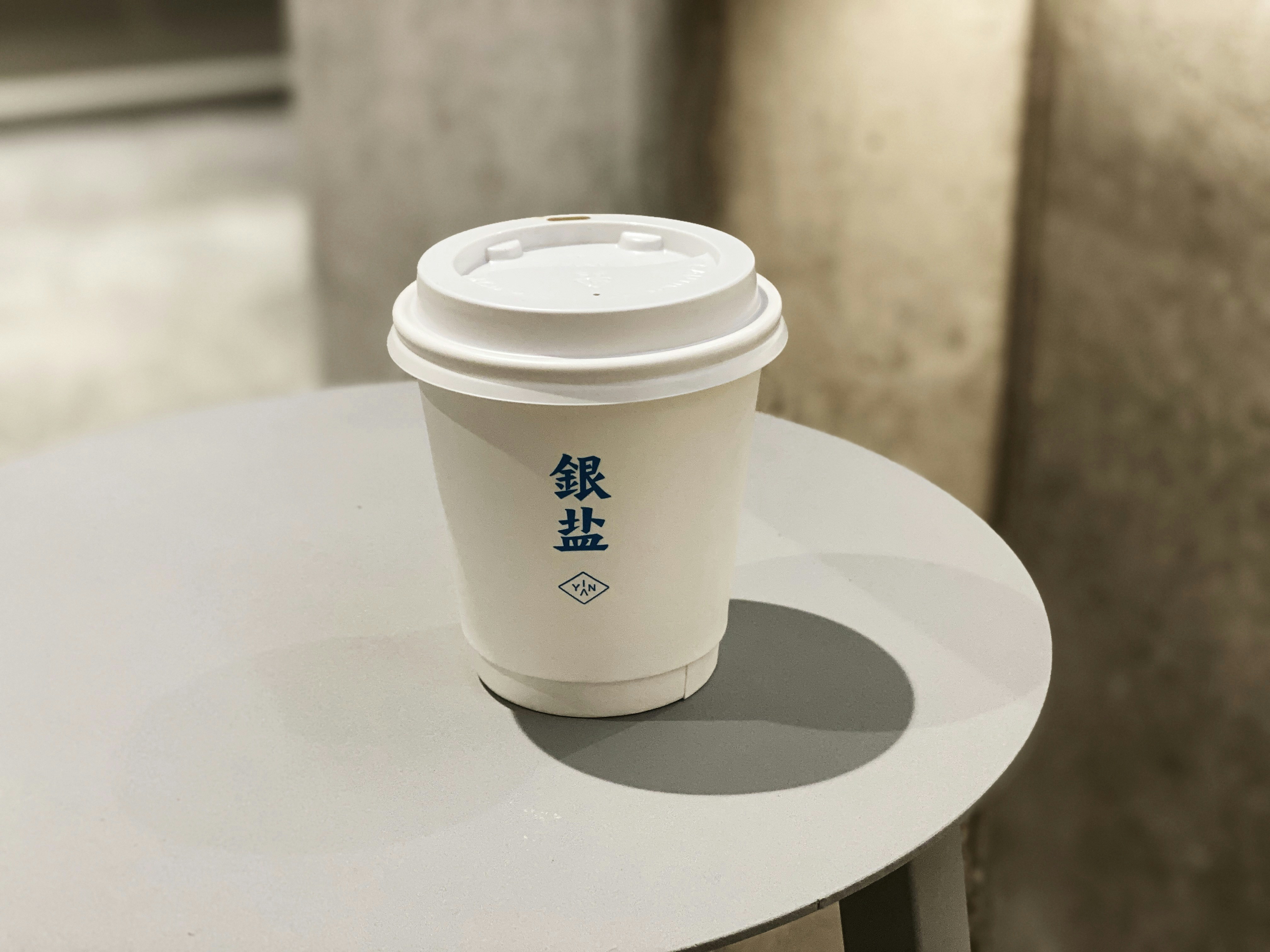 white disposable cup on white table drink zoom background