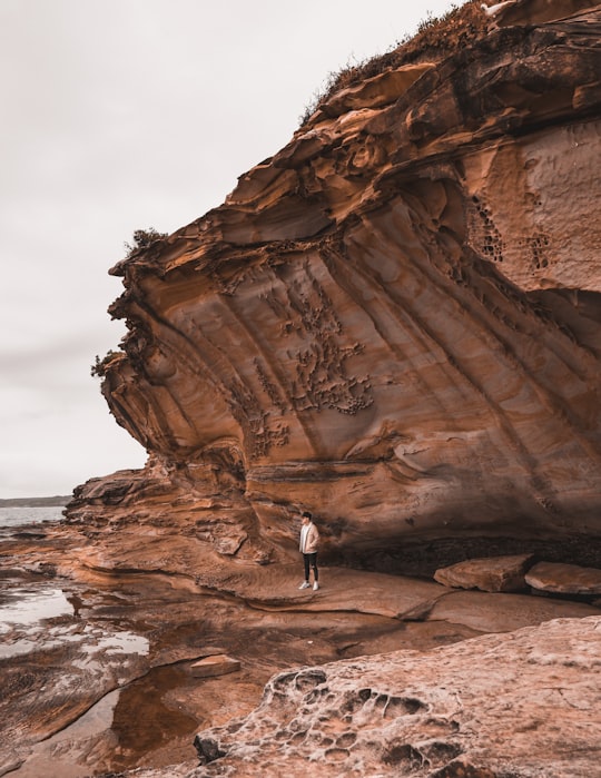 person standing on seashore in Bare Island Fort Australia