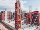 red metal structure with beam