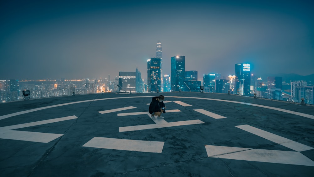 man sitting on rooftop