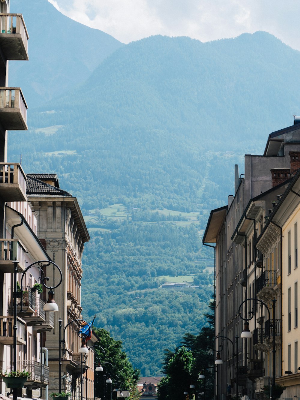 a city street with a mountain in the background