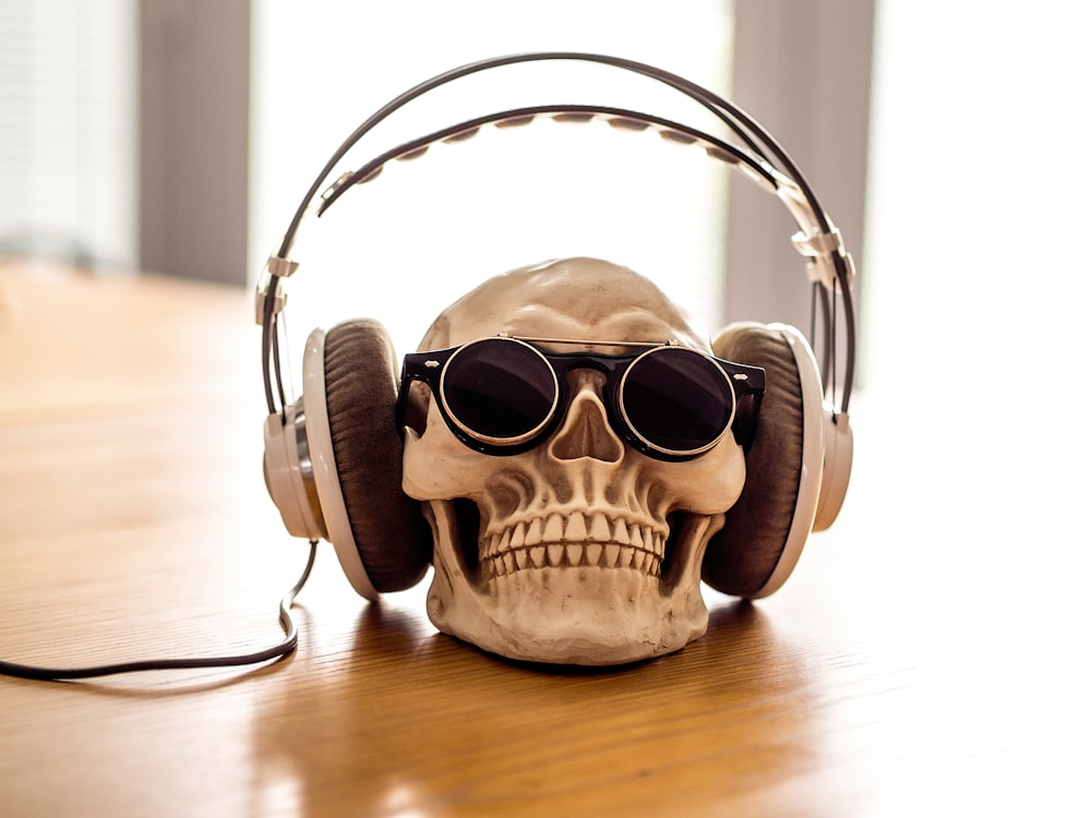 white headphones on skull decor