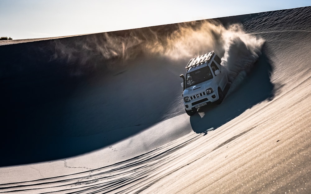 white SUV on desert during daytime