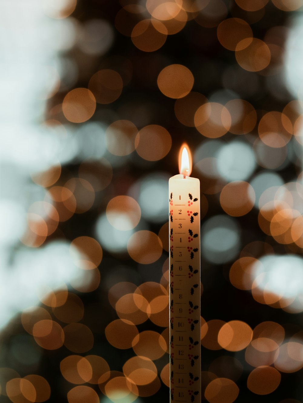 selective focus of lighted white candle