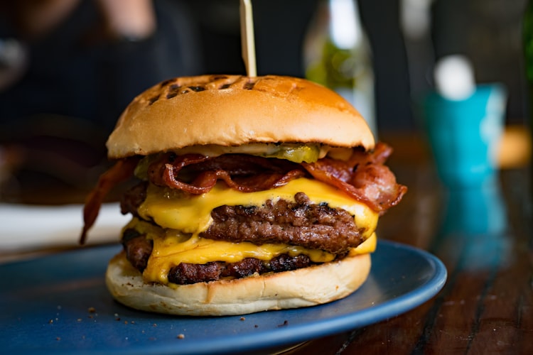 Side view of burger with bacon and cheese
