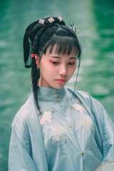 A serene portrait of a Ukrainian woman in traditional attire.