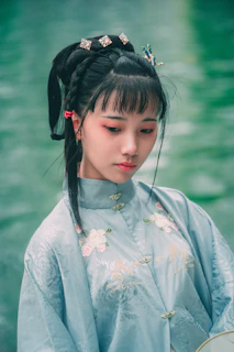 A striking portrait of Aina Asif in traditional attire, showcasing her graceful presence.