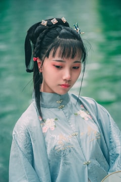 A serene portrait of a Ukrainian woman in traditional attire.