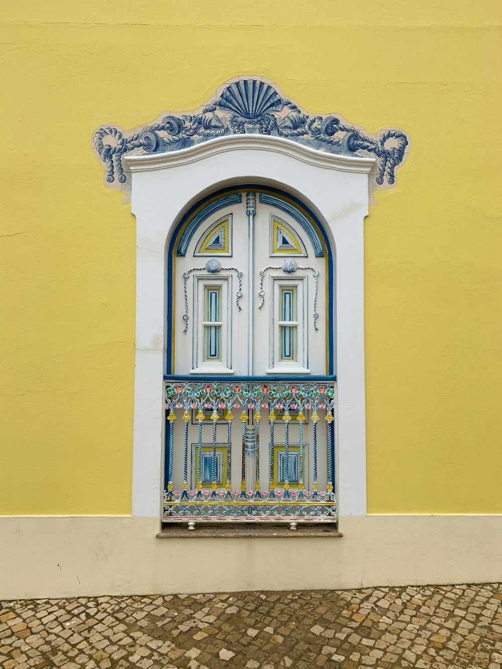 closed white and blue wooden cabinet