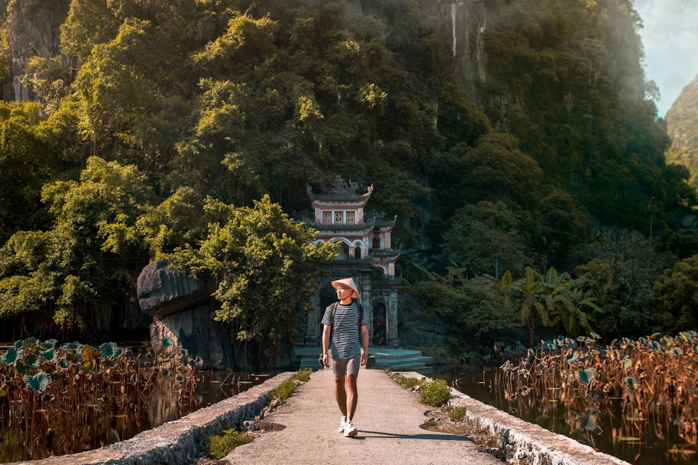 person walking on dirt pathway