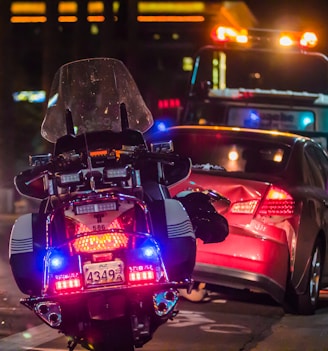 policeman leaning on sports car's window