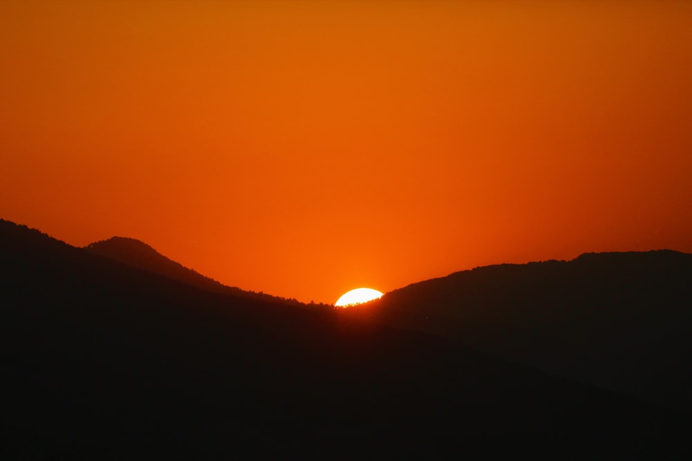 silhouette of mountains during golden hour