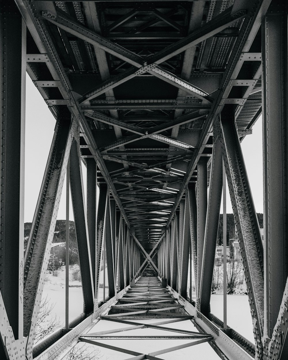 a black and white photo of a bridge