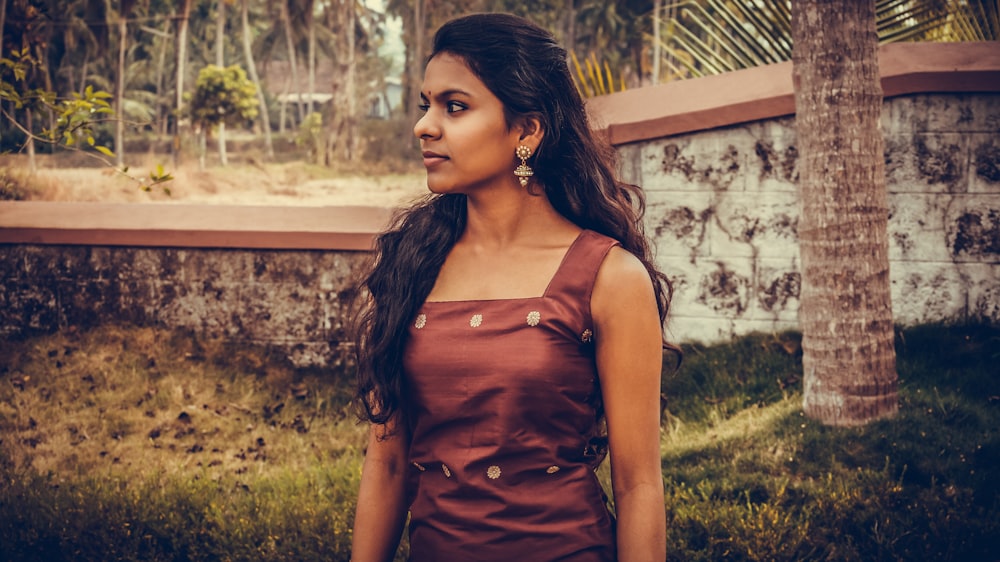 woman wearing brown dress