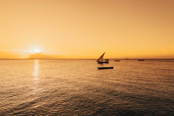 Dhow sailing off Zanzibar at sunset