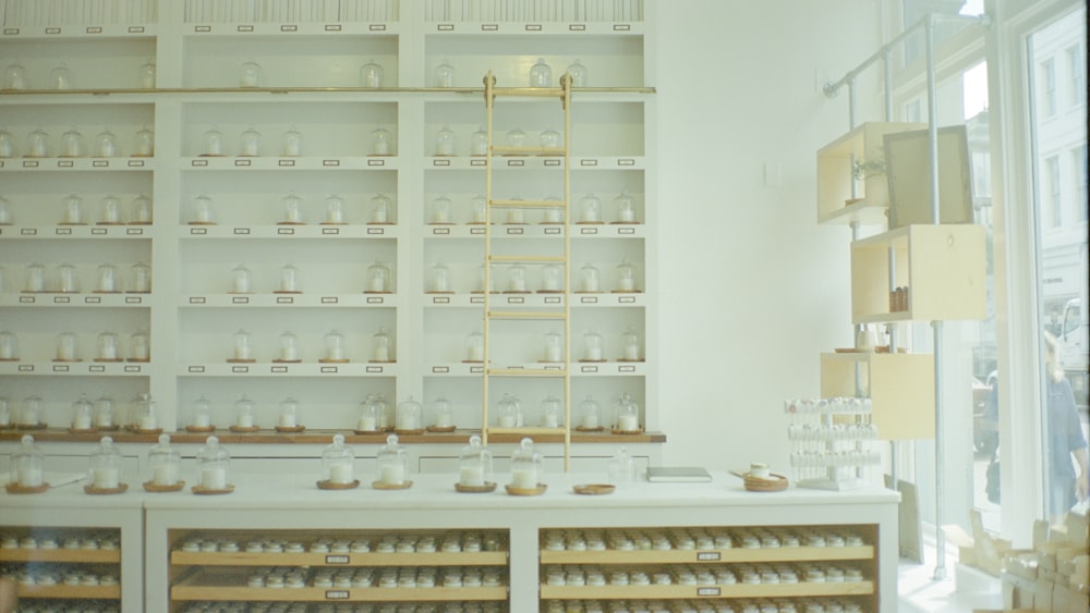 a room filled with lots of shelves filled with jars