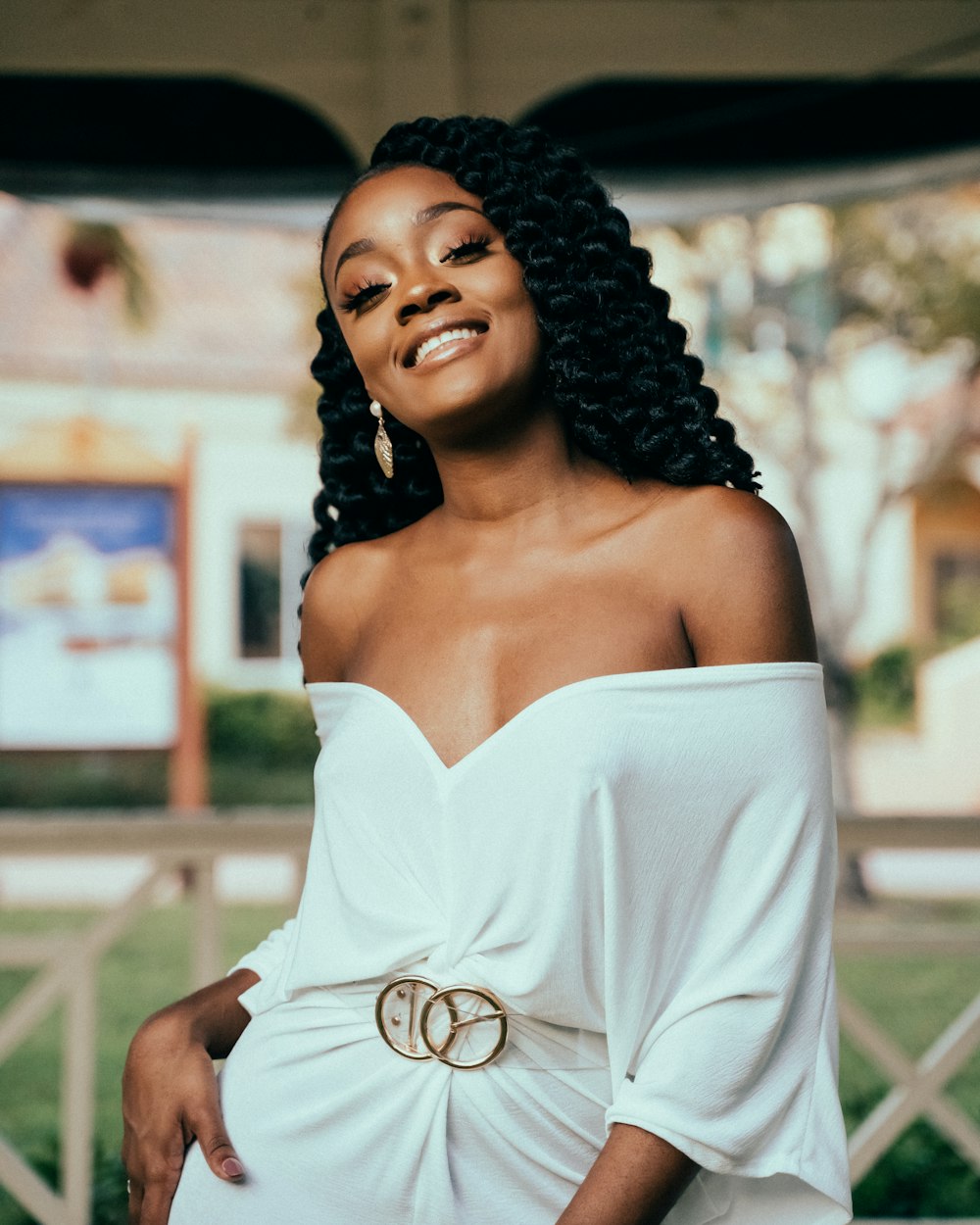 woman wearing white off-shoulder dress