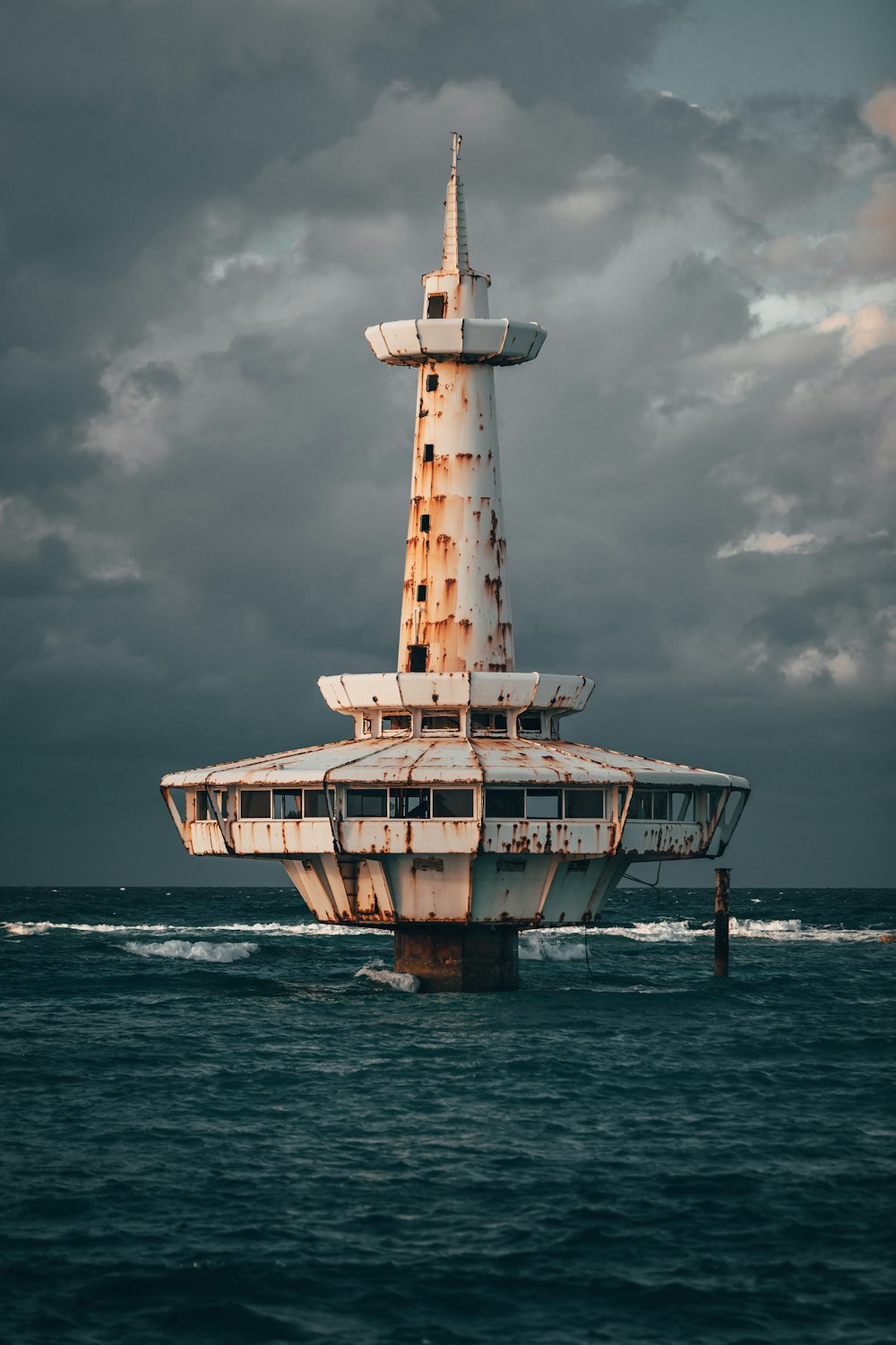 white lighthouse on sea