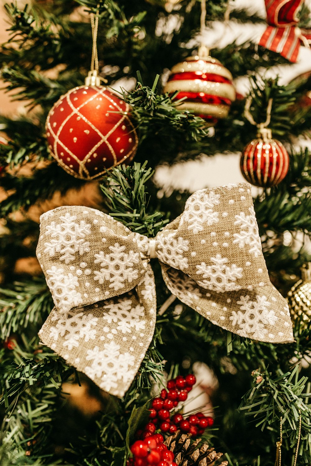 red and white Christmas baubles hanged on Christmas tree