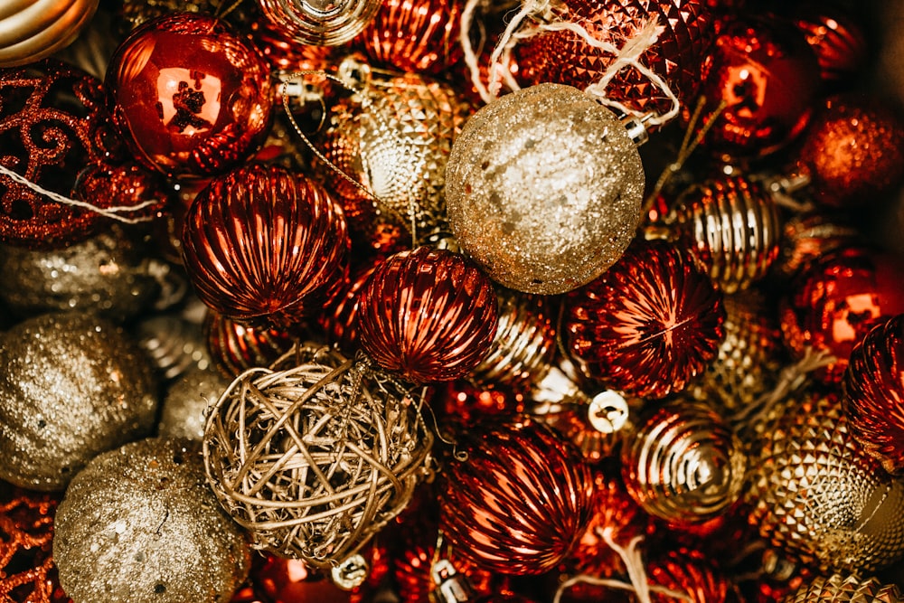 shallow focus photo of gold and red Christmas baubles